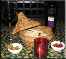 Halana Syrah, pita bread, olives, and harissa